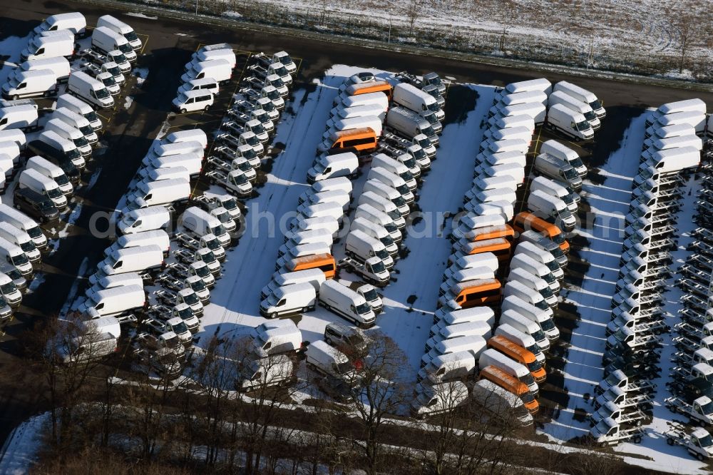 Ketzin from above - Wintry snowy site of the auto service center and transshipment Mosolf GmbH Etzin. The company in addition to logistics services, vehicle rental and sale, as well engineering, testing and equipment services