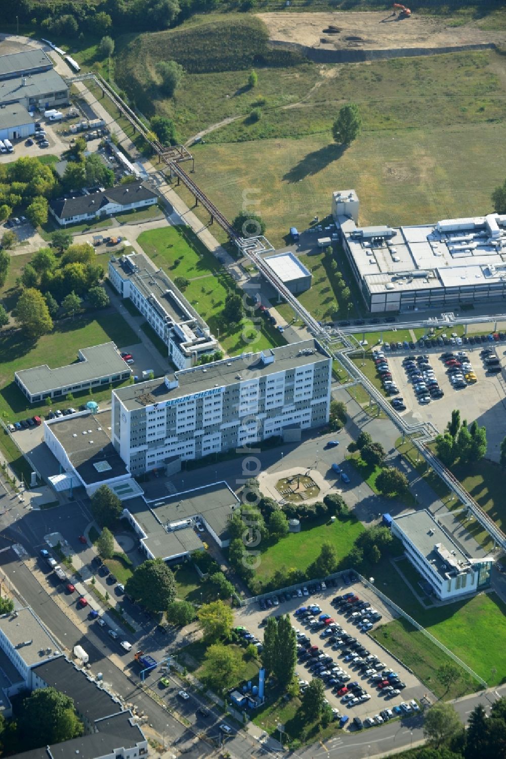 Aerial photograph Berlin - View of the grounds of the Berlin Chemie AG. The pharmaceutical company is a german subsidiary of the Menarini Group, which has been occupying a leading position in the Italian pharmaceutical market for many years