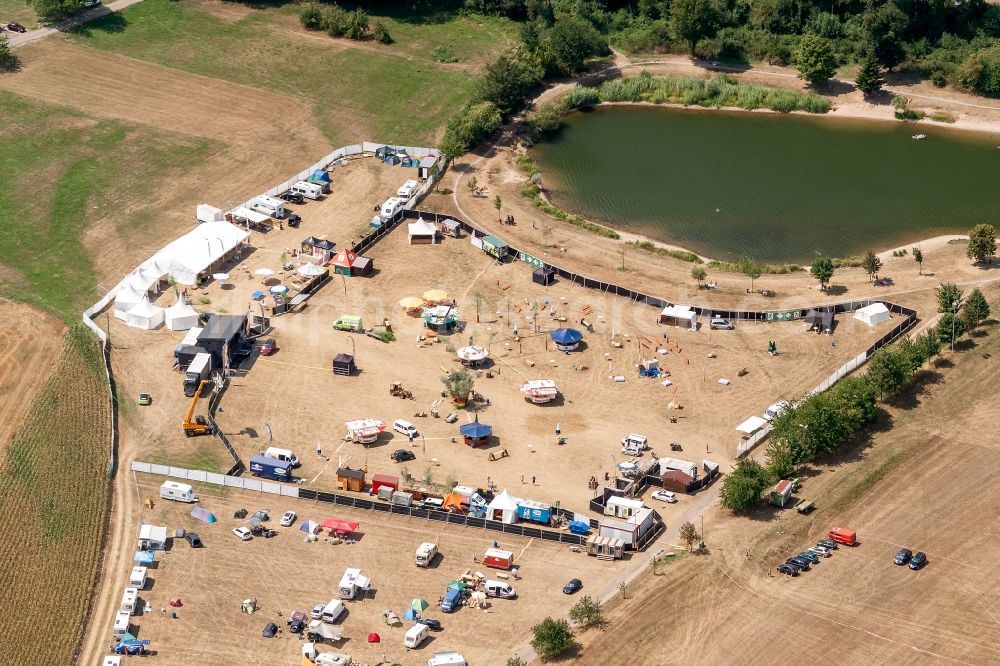 Berghaupten from above - Participants in the Black Forest on Fire Vorbereitung music festival on the event concert area in Berghaupten in the state Baden-Wurttemberg, Germany