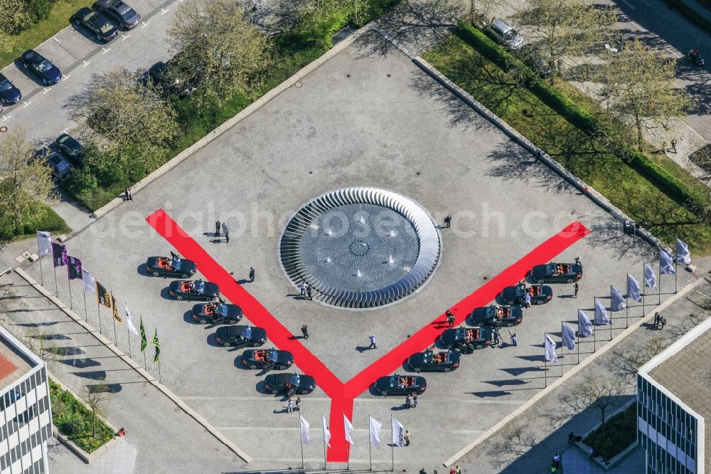 München from the bird's eye view: Site of the BMW Group Research and Innovation Centre, FIZ in Munich in Bavaria. In the picture are drawn up to twelve red line BMW Convertible cars