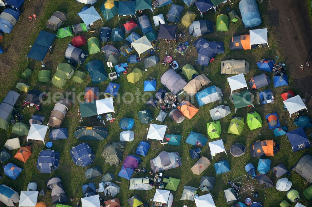 Nordholz from the bird's eye view: Participants in the Deichbrand Festival music festival on the event concert area in Nordholz in the state Lower Saxony, Germany