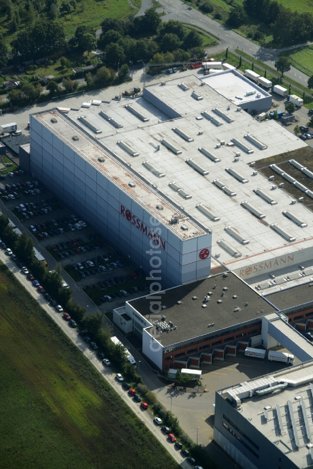 Burgwedel from above - Building complex and grounds of the Dirk Rossmann GmbH in Burgwedel in the state of Lower Saxony. The compound includes a logistics centre and the company headquarters and administrative offices of Rossmann