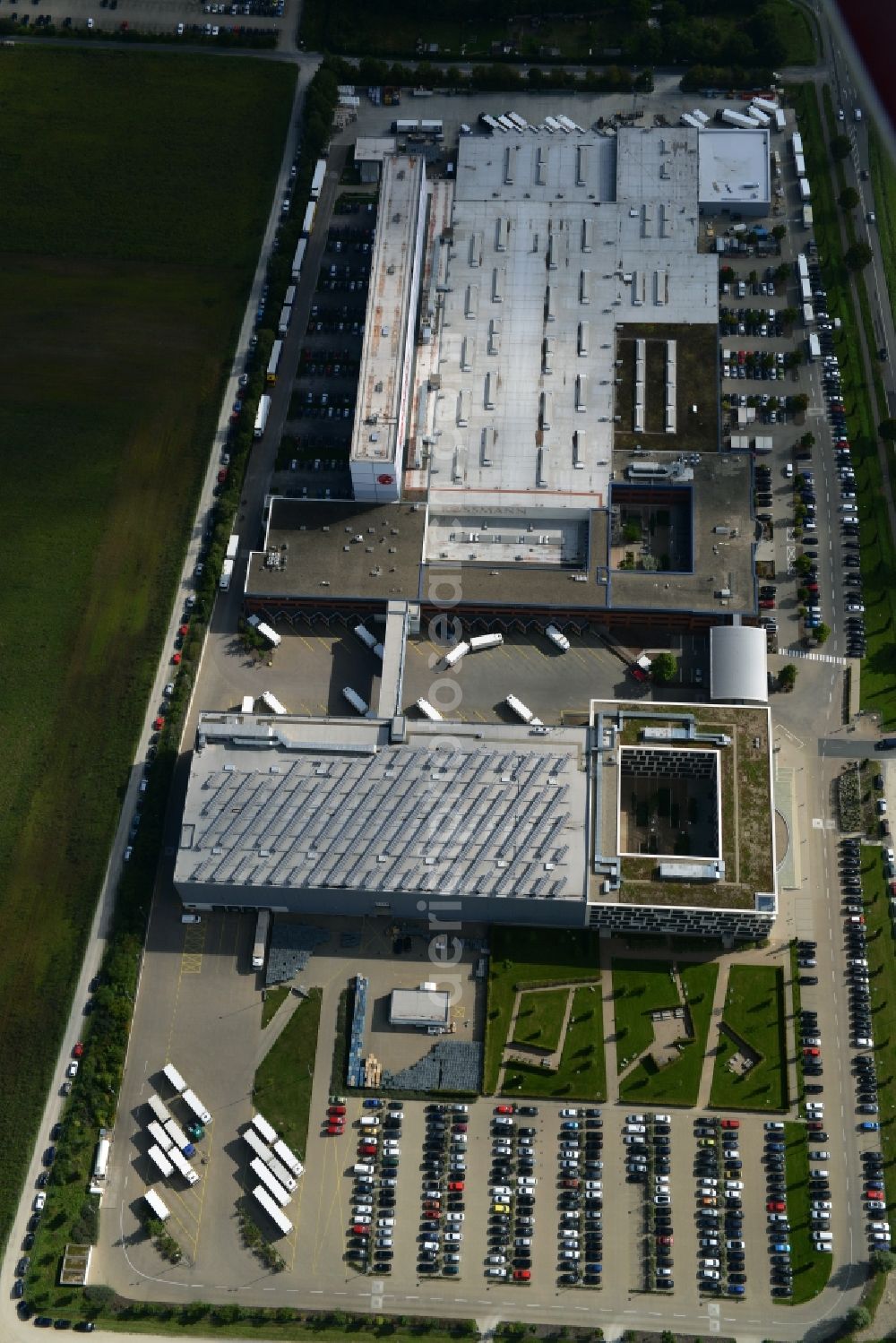 Burgwedel from above - Building complex and grounds of the Dirk Rossmann GmbH in Burgwedel in the state of Lower Saxony. The compound includes a logistics centre and the company headquarters and administrative offices of Rossmann