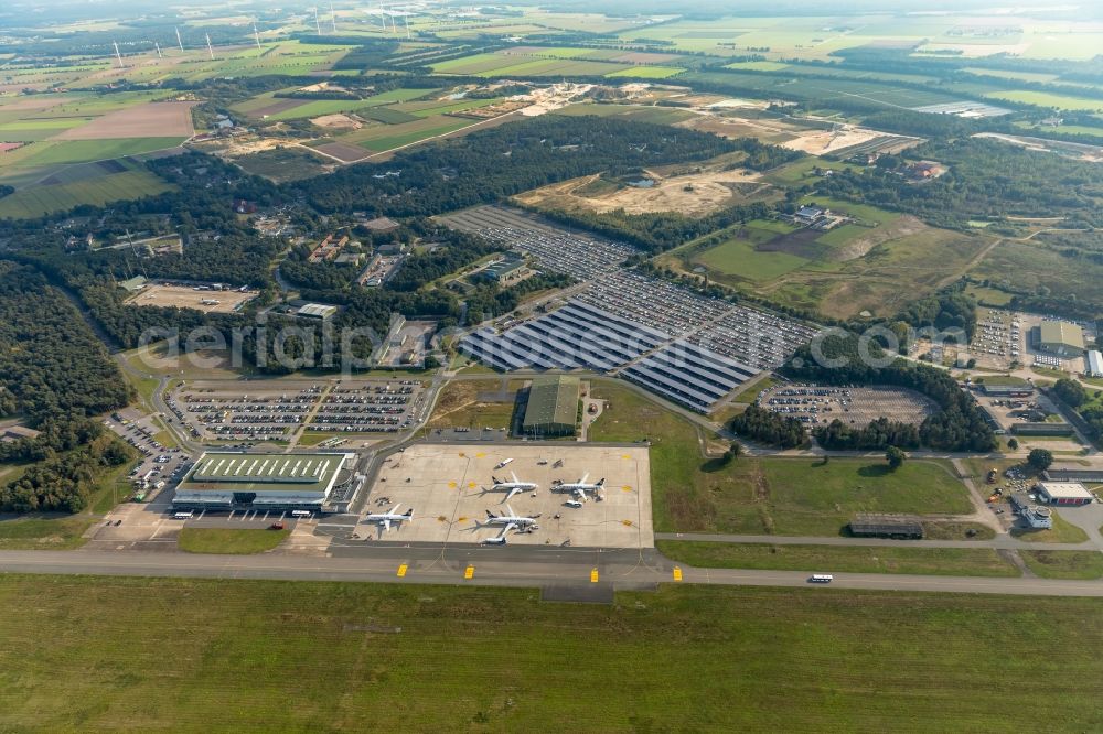 Weeze from above - Runway with hangar taxiways and terminals on the grounds of the airport Airport Weeze Flughafen Niederrhein GmbH in Weeze in the state North Rhine-Westphalia, Germany