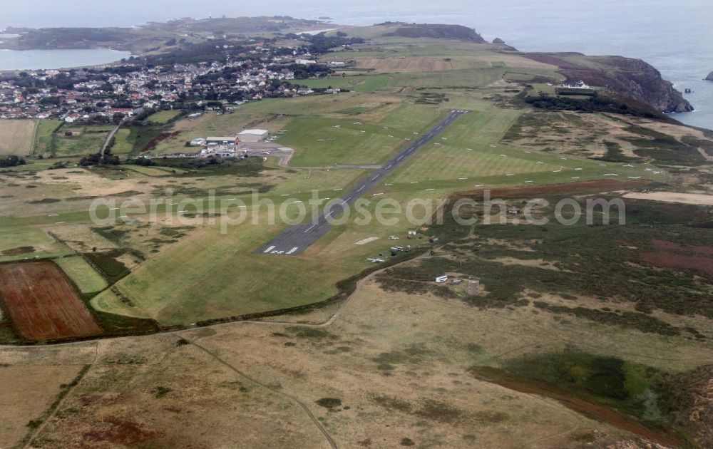 Aerial image Aldernay - Runway with hangar taxiways and terminals on the grounds of the airport in Aldernay in Aurigny, Guernsey