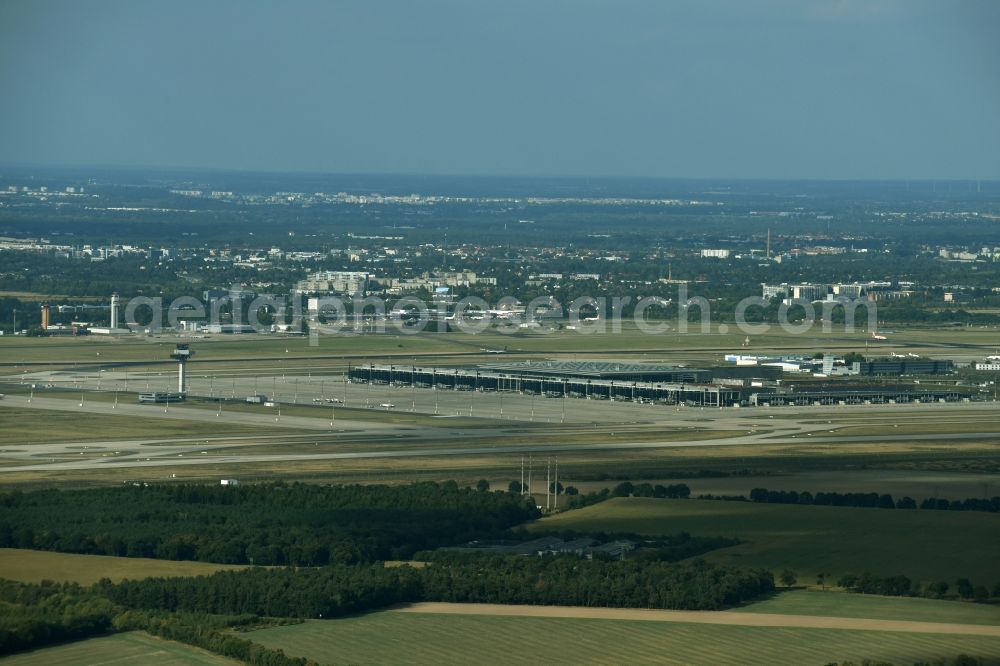 Schönefeld from above - Runway with hangar taxiways and terminals on the grounds of the airport BER in Schoenefeld in the state Brandenburg