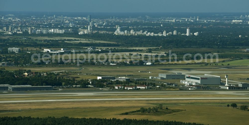 Schönefeld from the bird's eye view: Runway with hangar taxiways and terminals on the grounds of the airport BER in Schoenefeld in the state Brandenburg