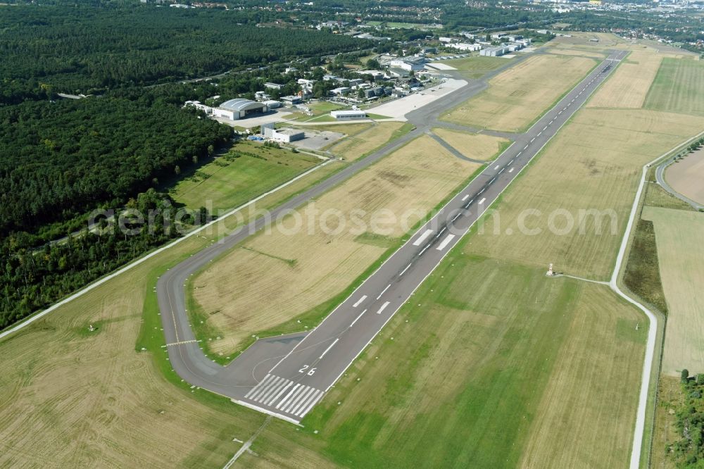 Braunschweig from above - Runway with hangar taxiways and terminals on the grounds of the airport Flughafen Braunschweig-Wolfsburg GmbH in Braunschweig in the state Lower Saxony