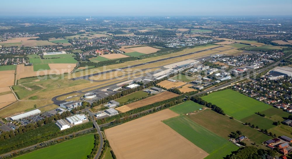 Dortmund from the bird's eye view: Runway with hangar taxiways and terminals on the grounds of the airport Dortmund in Dortmund in the state North Rhine-Westphalia