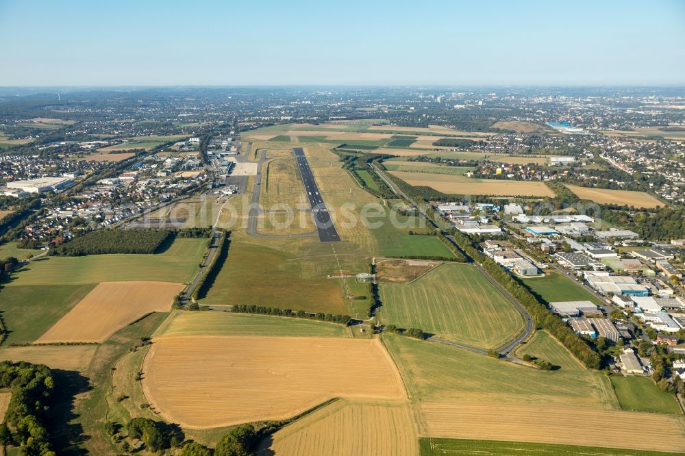 Dortmund from the bird's eye view: Runway with hangar taxiways and terminals on the grounds of the airport in Dortmund in the state North Rhine-Westphalia, Germany