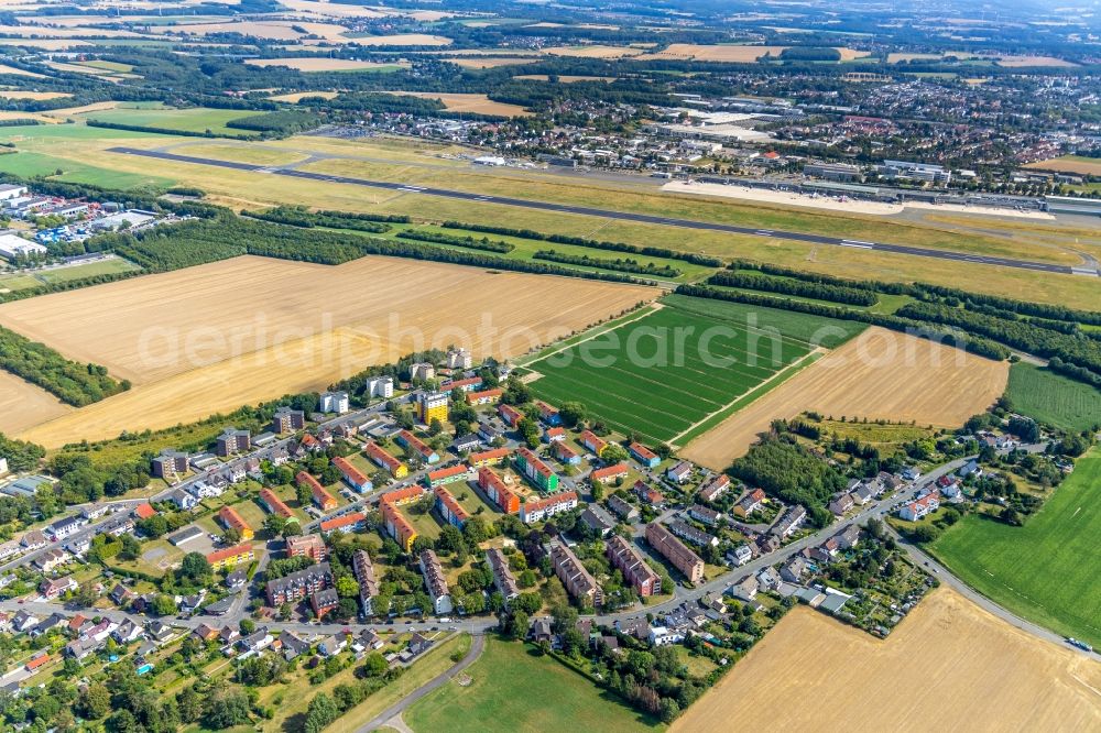 Dortmund from the bird's eye view: Runway with hangar taxiways and terminals on the grounds of the airport in Dortmund in the state North Rhine-Westphalia, Germany