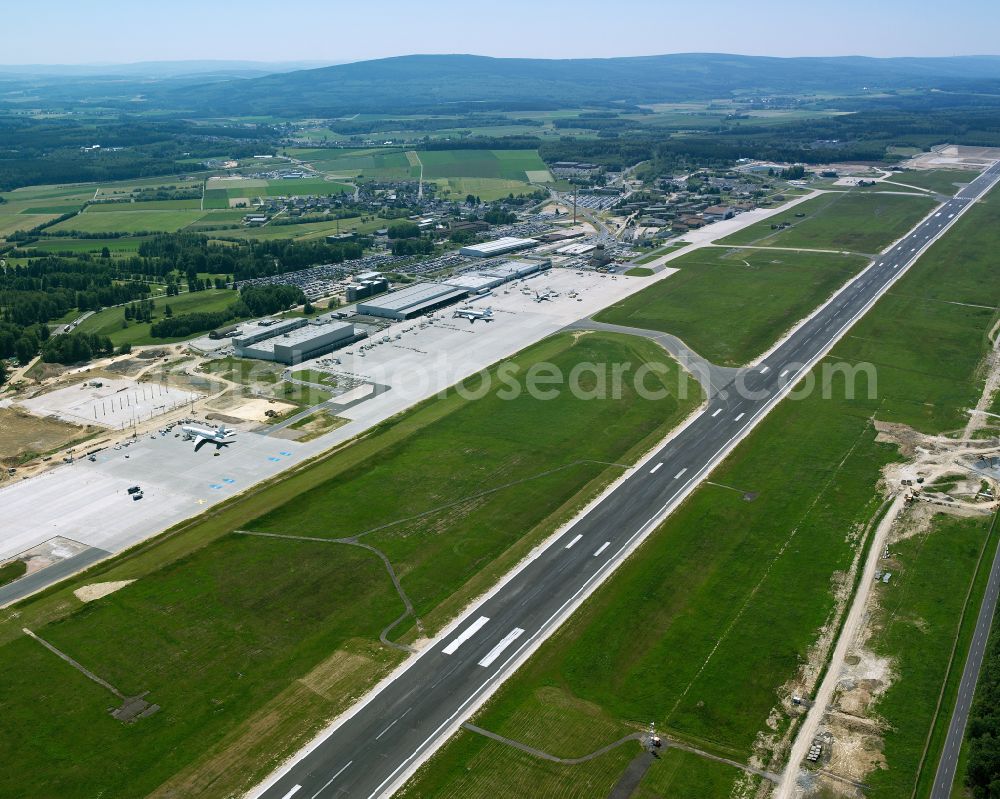 Lautzenhausen from above - Runway with hangar taxiways and terminals on the grounds of the airport Frankfurt-Hahn in Lautzenhausen in the state Rhineland-Palatinate, Germany