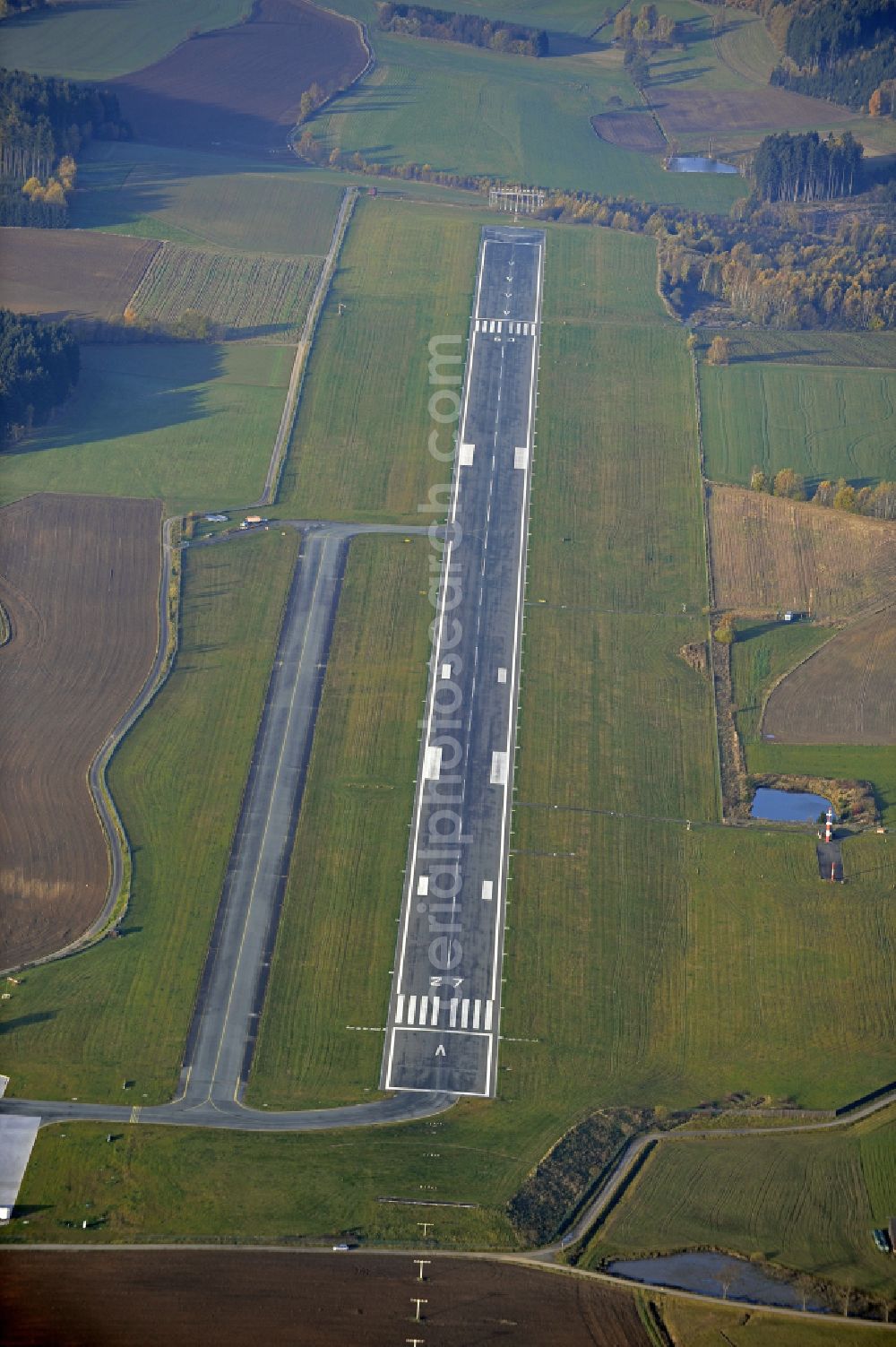 Hof from the bird's eye view: Runway with hangar taxiways and terminals on the grounds of the airport in Hof in the state Bavaria, Germany