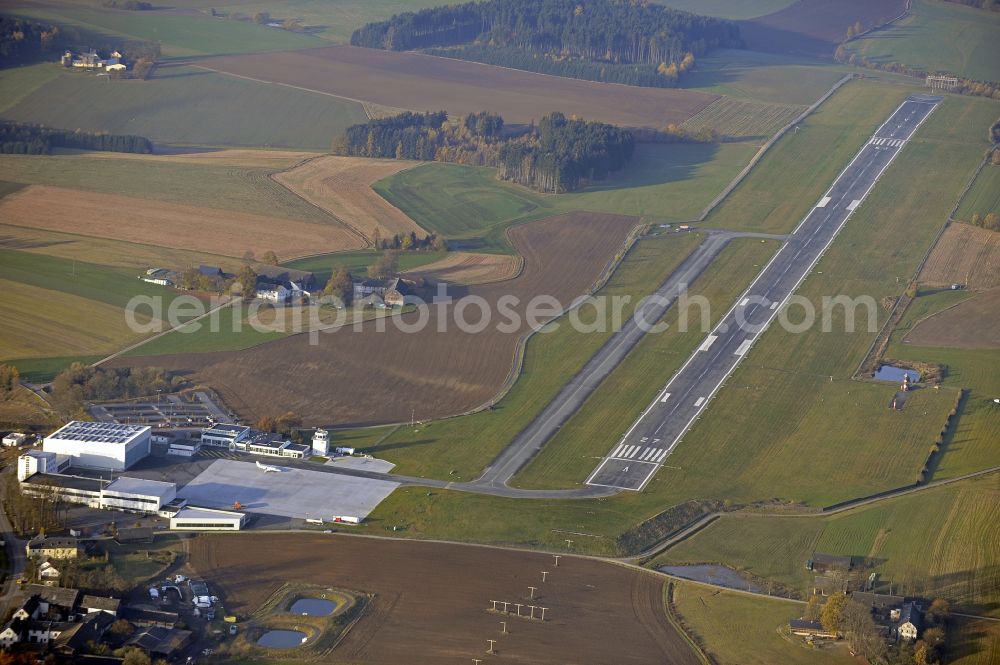 Hof from above - Runway with hangar taxiways and terminals on the grounds of the airport in Hof in the state Bavaria, Germany