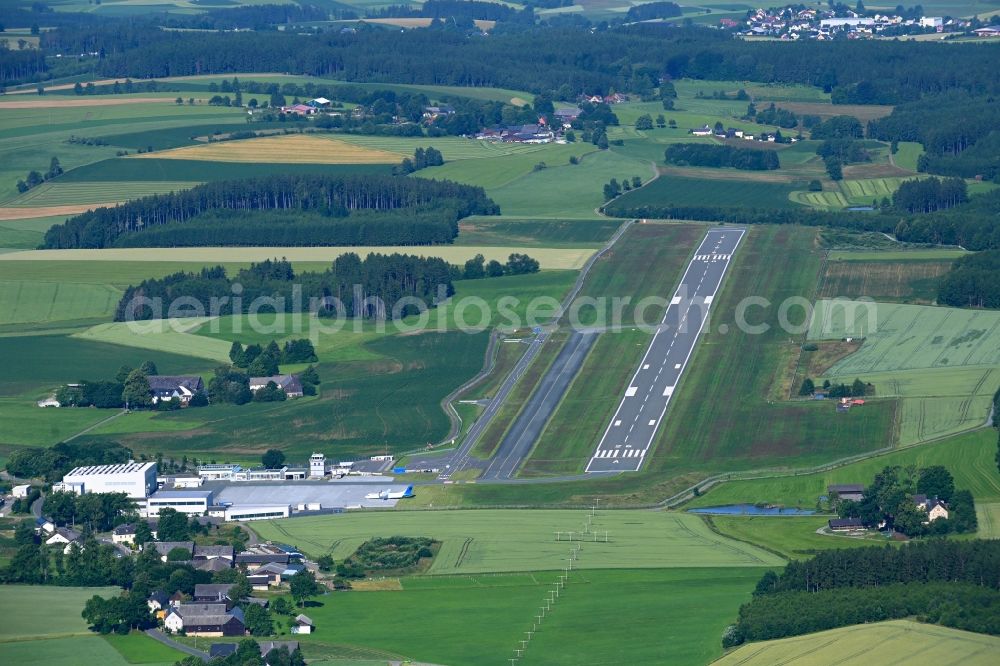 Hof from the bird's eye view: Runway with hangar taxiways and terminals on the grounds of the airport in Hof in the state Bavaria, Germany