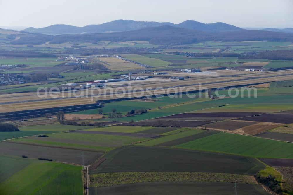 Calden from the bird's eye view: Runway with hangar taxiways and terminals on the grounds of the airport Kassel-Calden in Calden in the state Hesse, Germany