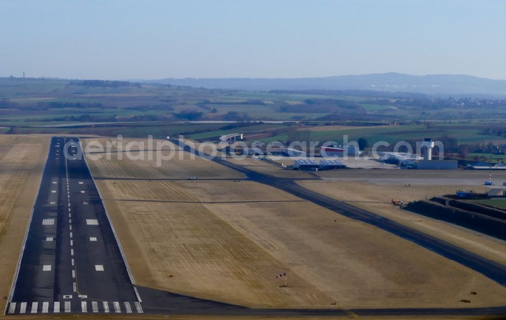 Grebenstein from the bird's eye view: Runway with hangar taxiways and terminals on the grounds of the airport Kassel-Calden in Grebenstein in the state Hesse, Germany