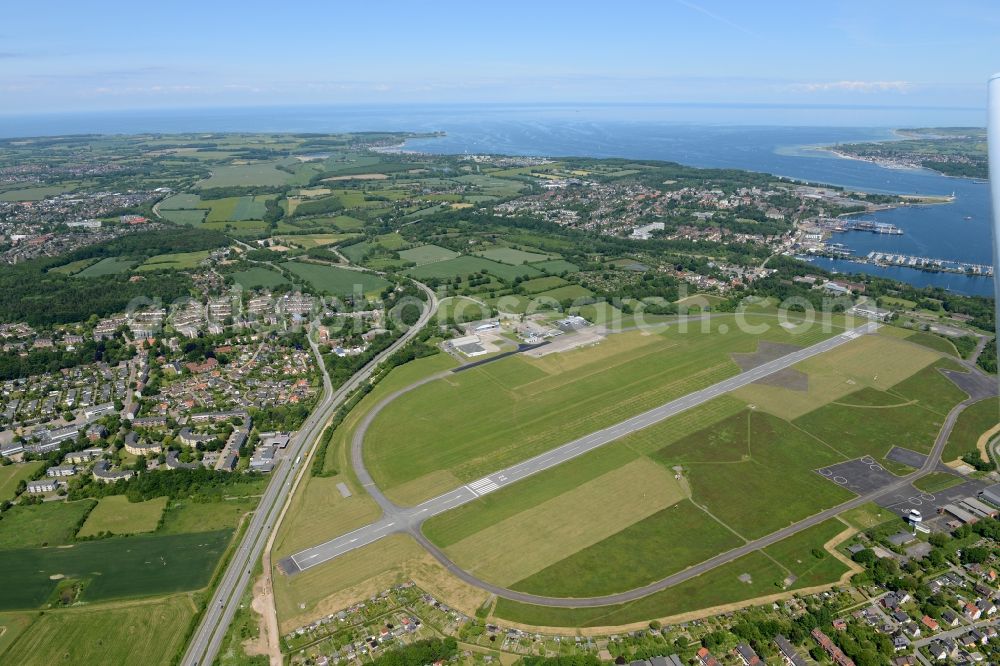 Kiel from above - Runway with hangar taxiways and terminals on the grounds of the airport in Kiel in the state Schleswig-Holstein