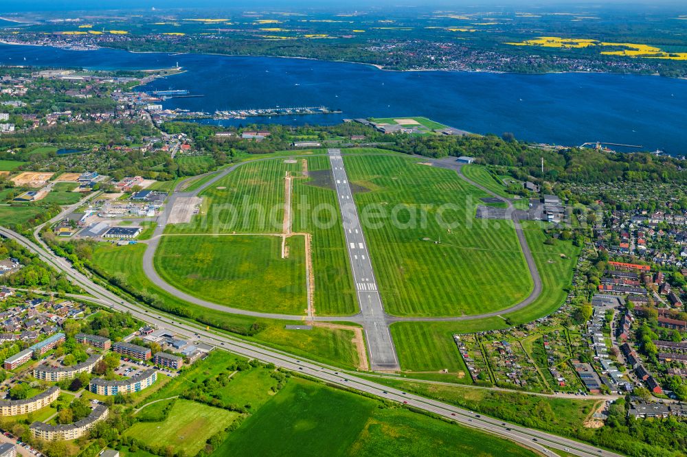 Kiel from above - Runway with hangar taxiways and terminals on the grounds of the airport in Kiel in the state Schleswig-Holstein