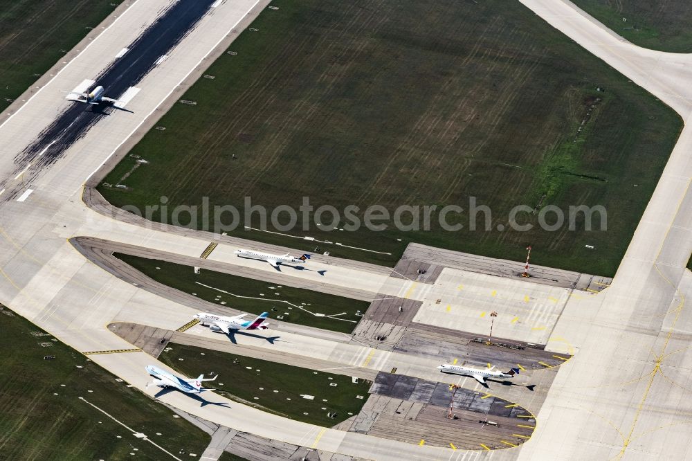 München from above - Runway with hangar taxiways and terminals on the grounds of the airport in Munich in the state Bavaria, Germany