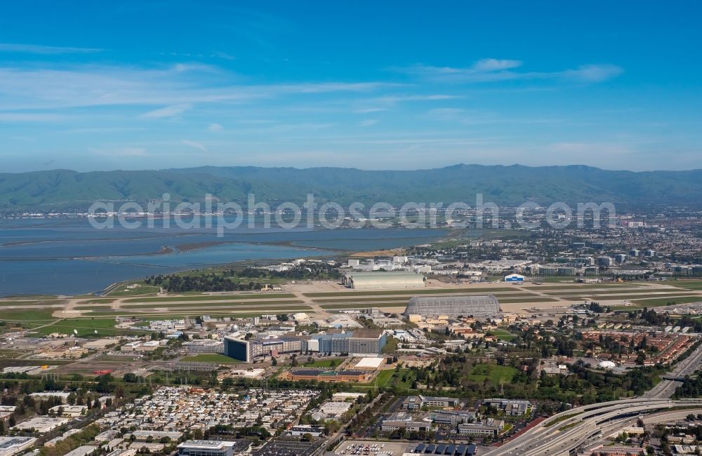 Aerial photograph Mountain View - Runway with hangar taxiways and terminals on the grounds of the airport Moffett Federal Airfield in Mountain View in California in the USA. The airfield is being run by Google Inc