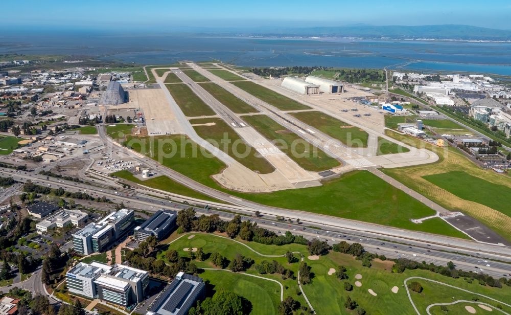 Mountain View from the bird's eye view: Runway with hangar taxiways and terminals on the grounds of the airport Moffett Federal Airfield in Mountain View in California in the USA. The airfield is being run by Google Inc