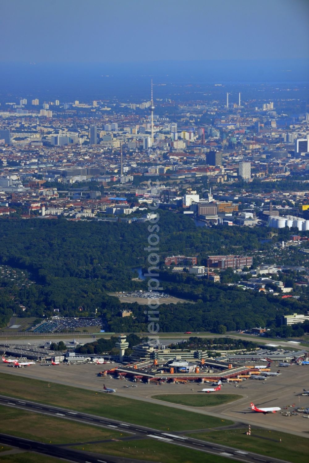 Berlin from above - Runway with hangar taxiways and terminals on the grounds of the airport in the district Tegel in Berlin, Germany