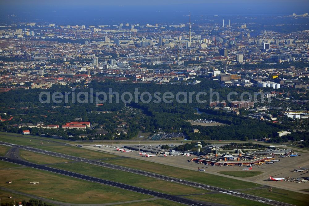 Berlin from the bird's eye view: Runway with hangar taxiways and terminals on the grounds of the airport in the district Tegel in Berlin, Germany