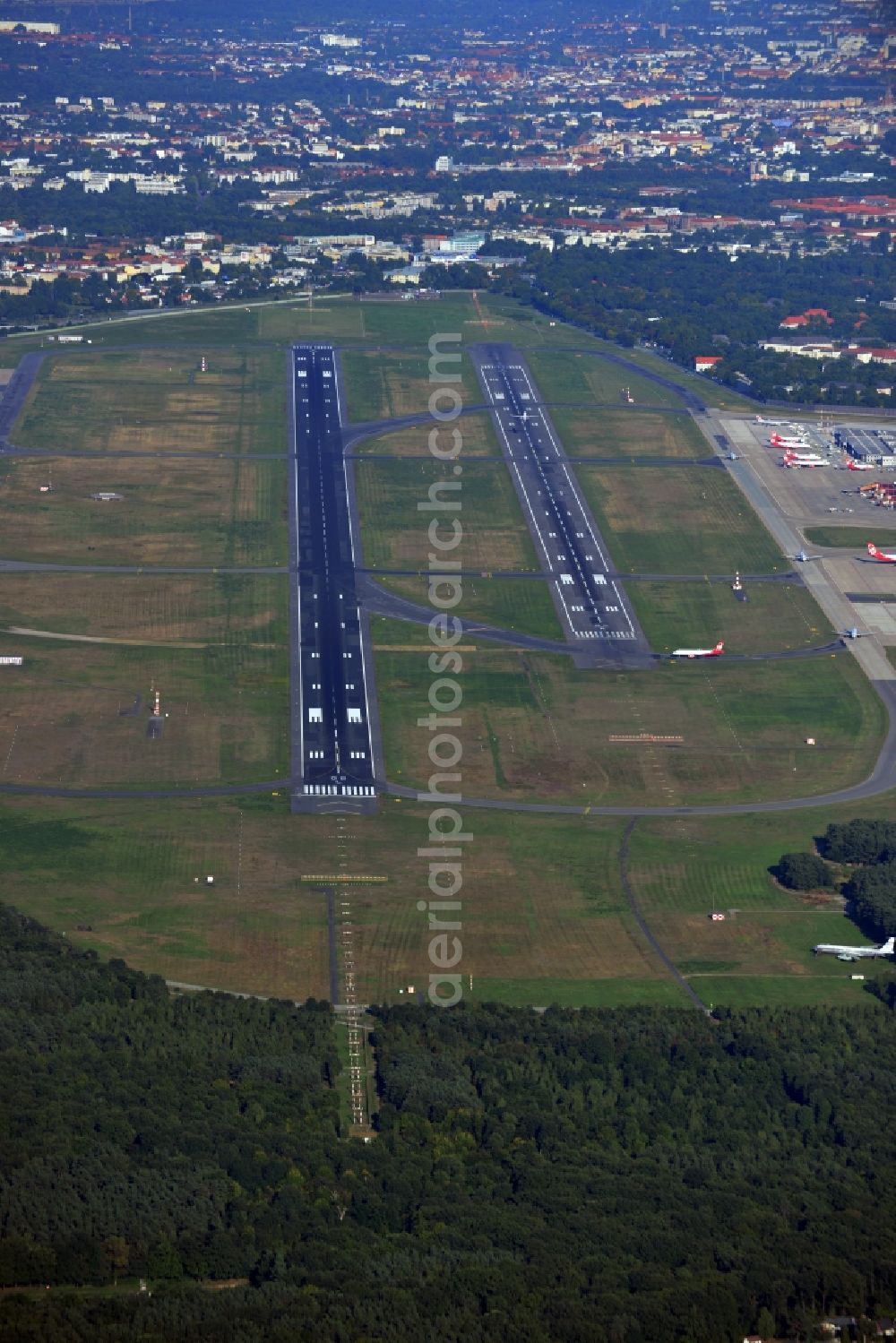 Berlin from above - Runway with hangar taxiways and terminals on the grounds of the airport in the district Tegel in Berlin, Germany