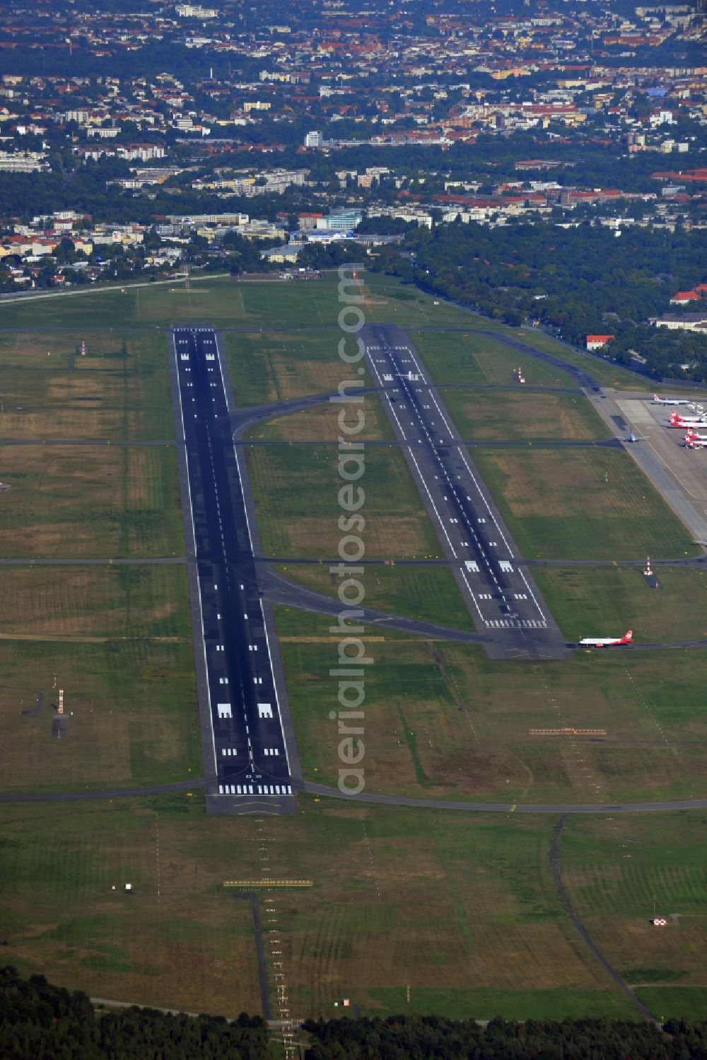 Berlin from the bird's eye view: Runway with hangar taxiways and terminals on the grounds of the airport in the district Tegel in Berlin, Germany