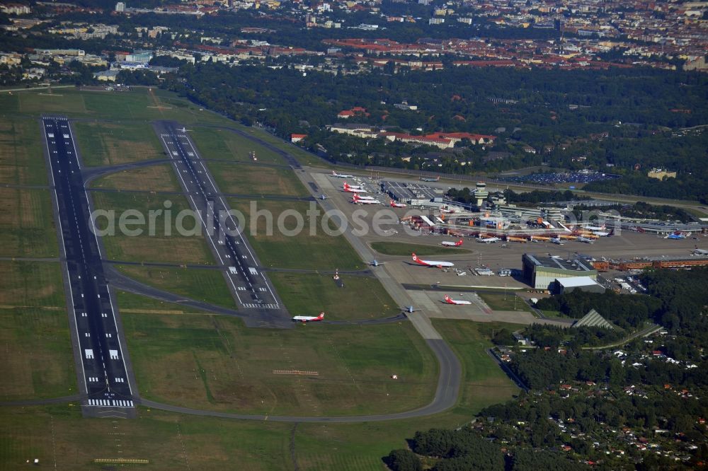 Aerial image Berlin - Runway with hangar taxiways and terminals on the grounds of the airport in the district Tegel in Berlin, Germany