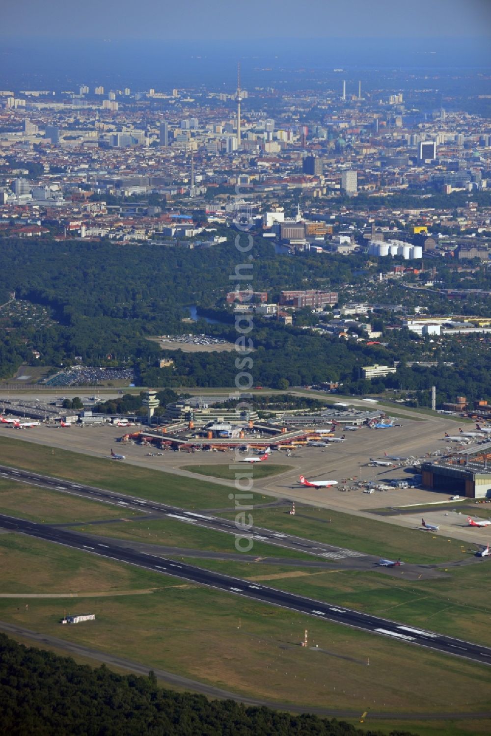 Berlin from above - Runway with hangar taxiways and terminals on the grounds of the airport in the district Tegel in Berlin, Germany