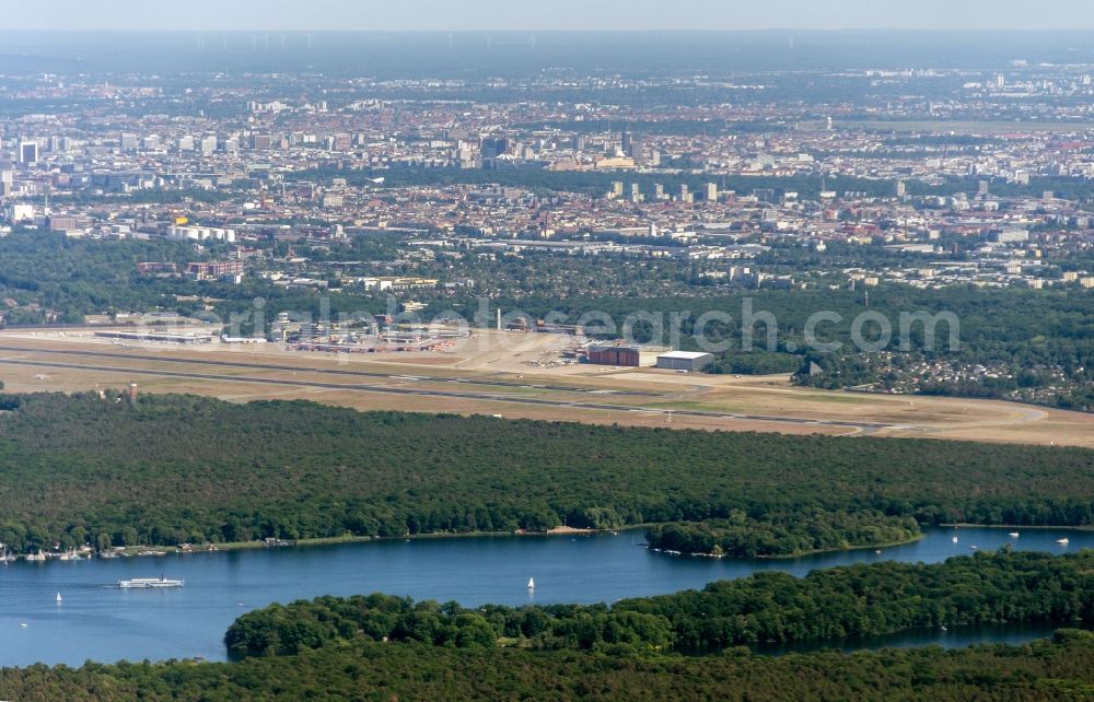 Berlin from the bird's eye view: Runway with hangar taxiways and terminals on the grounds of the airport in the district Tegel in Berlin, Germany