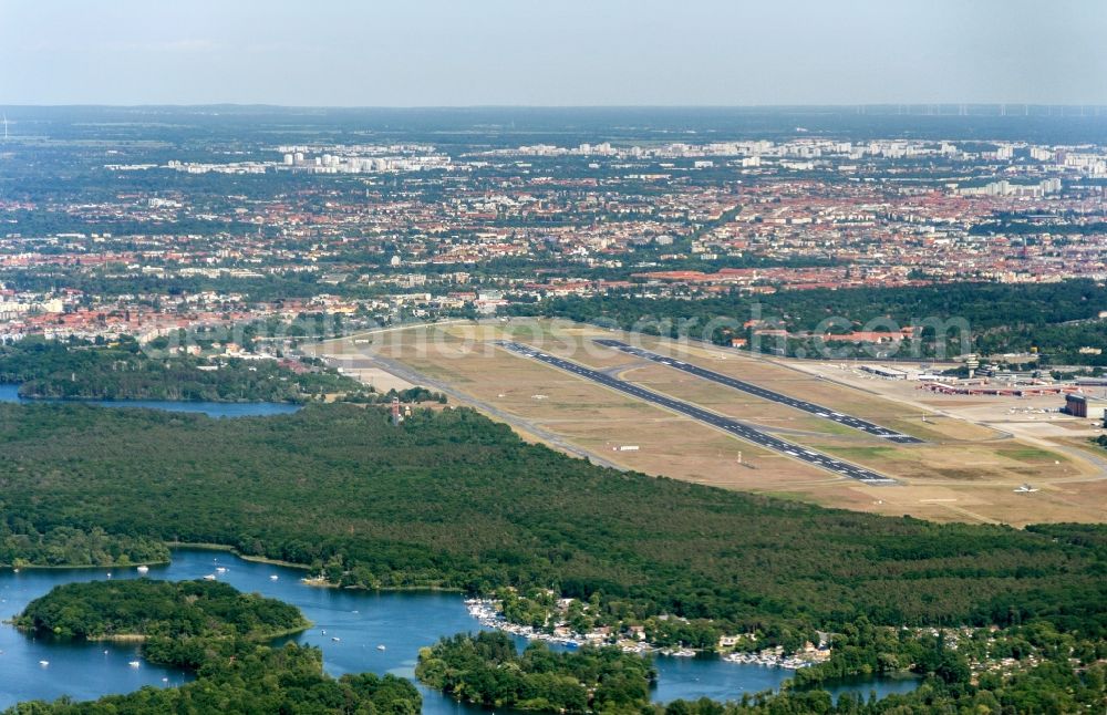 Aerial image Berlin - Runway with hangar taxiways and terminals on the grounds of the airport in the district Tegel in Berlin, Germany