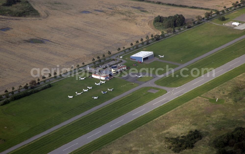 Aerial photograph Samtens - Runway with hangar taxiways and terminals on the grounds of the airport Samtens-Guettin Ostseeflughafen Guettin in Samtens in the state Mecklenburg - Western Pomerania