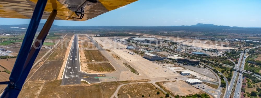 Aerial image Palma - Runway with hangar taxiways and terminals on the grounds of the airport Sant Joan in the district Llevant de Palma District in Palma in Balearic island of Mallorca, Spain