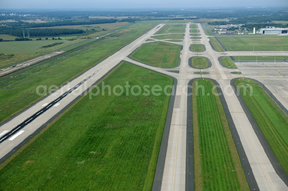 Schönefeld from the bird's eye view: Runway with hangar taxiways and terminals on the grounds of the airport in Schoenefeld in the state Brandenburg, Germany