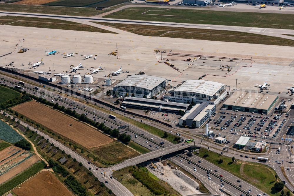 Stuttgart from above - Runway with hangar taxiways and terminals on the grounds of the airport in Stuttgart in the state Baden-Wurttemberg, Germany