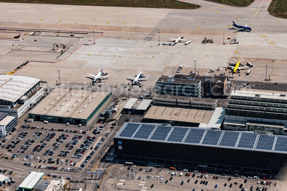 Stuttgart from the bird's eye view: Runway with hangar taxiways and terminals on the grounds of the airport in Stuttgart in the state Baden-Wurttemberg, Germany