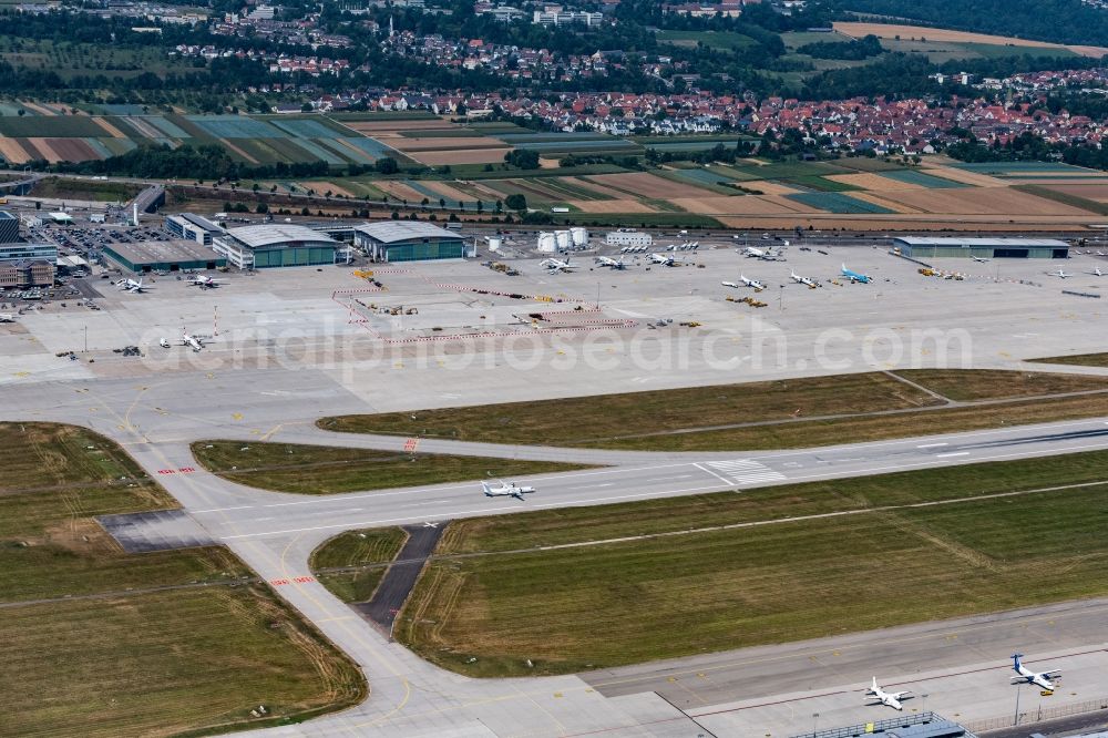 Stuttgart from above - Runway with hangar taxiways and terminals on the grounds of the airport in Stuttgart in the state Baden-Wurttemberg, Germany