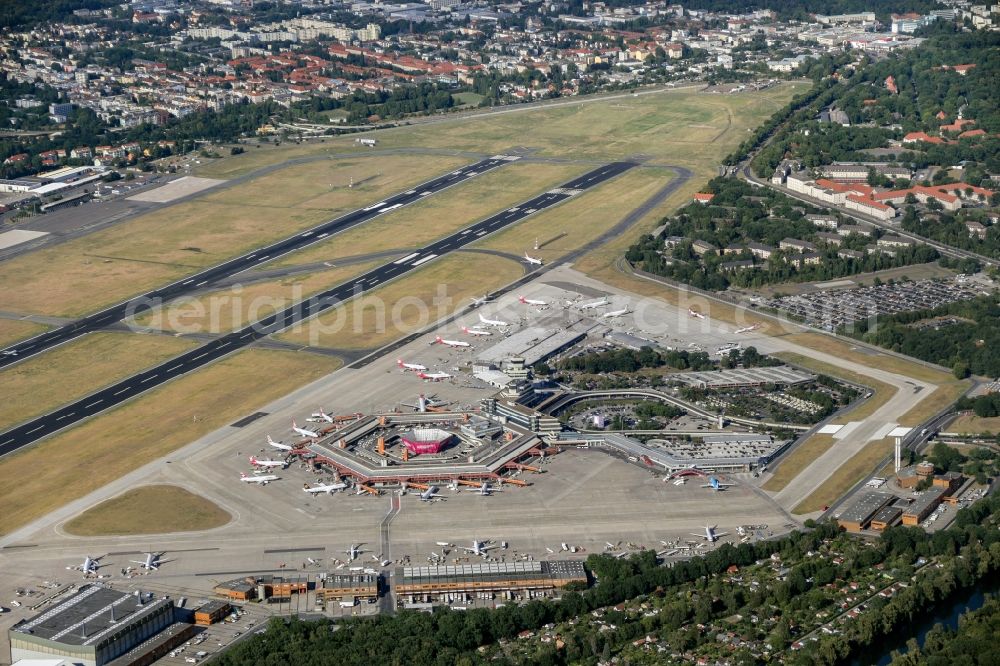 Aerial image Berlin - Runway with hangar taxiways and terminals on the grounds of the Tegel airport in Berlin