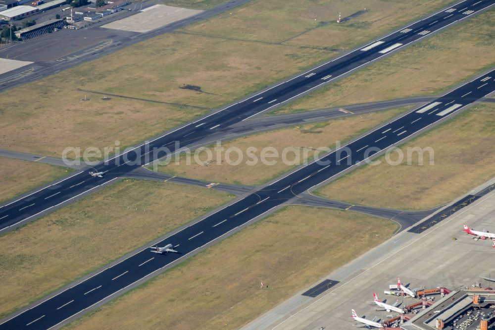 Aerial photograph Berlin - Runway with hangar taxiways and terminals on the grounds of the Tegel airport in Berlin