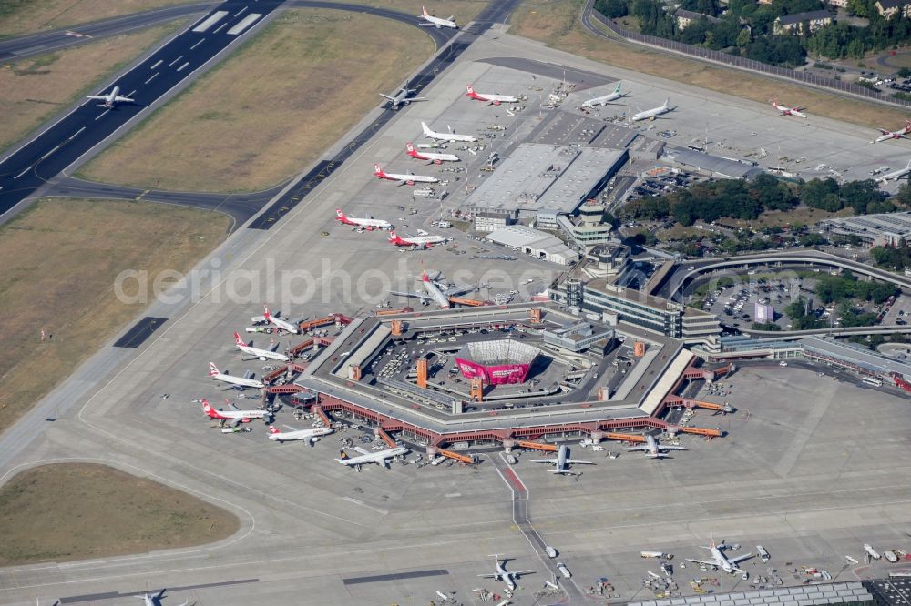 Berlin from above - Runway with hangar taxiways and terminals on the grounds of the Tegel airport in Berlin