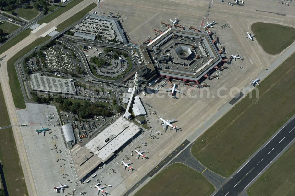 Aerial image Berlin - Runway with hangar taxiways and terminals on the grounds of the Tegel airport in Berlin