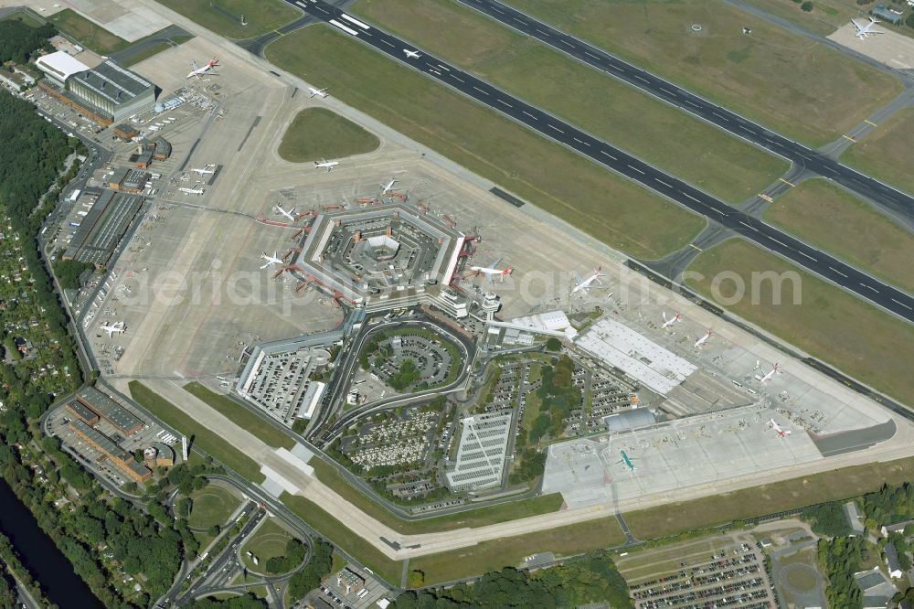 Berlin from above - Runway with hangar taxiways and terminals on the grounds of the Tegel airport in Berlin