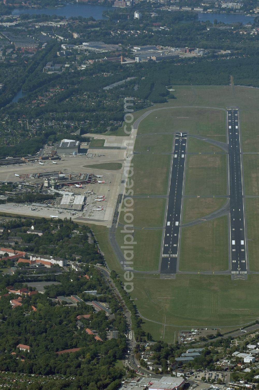 Aerial image Berlin - Runway with hangar taxiways and terminals on the grounds of the Tegel airport in Berlin