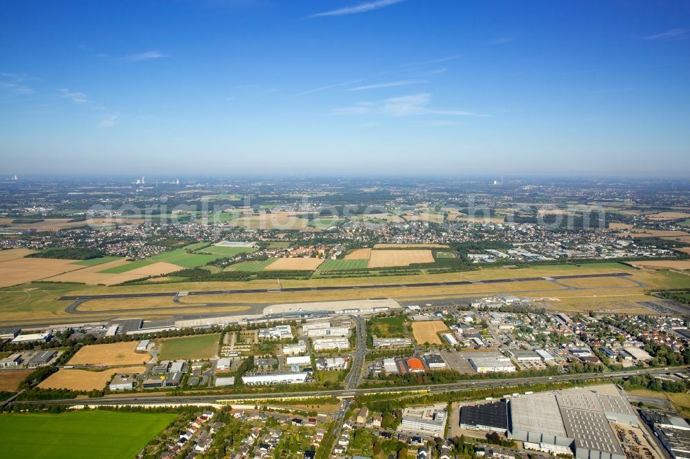 Dortmund from the bird's eye view: Runway with hangar taxiways and terminals on the grounds of the airport in Dortmund in the state North Rhine-Westphalia