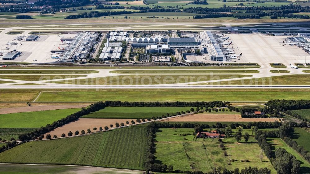 Aerial photograph Oberding - Runways with taxiways, hangars and terminals on the area of Munich Airport in the state of Bavaria. Munich Airport Franz Josef Strauss (IATA: MUC, ICAO: EDDM) is the commercial airport in the Bavarian capital of Munich and is one of the largest aviation hubs in Europe