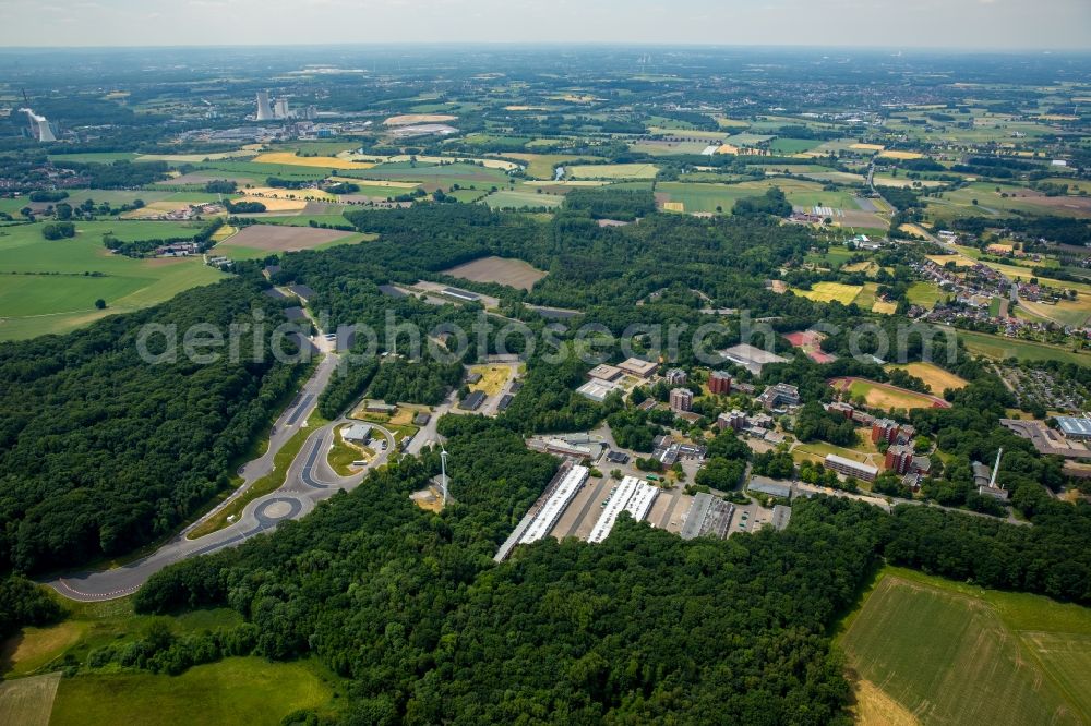 Selm from above - Compound of the technology and research centre of Selm in the state of North Rhine-Westphalia. The wide area with its buildings, halls and track includes the centre for loading safety and the police academy of Selm