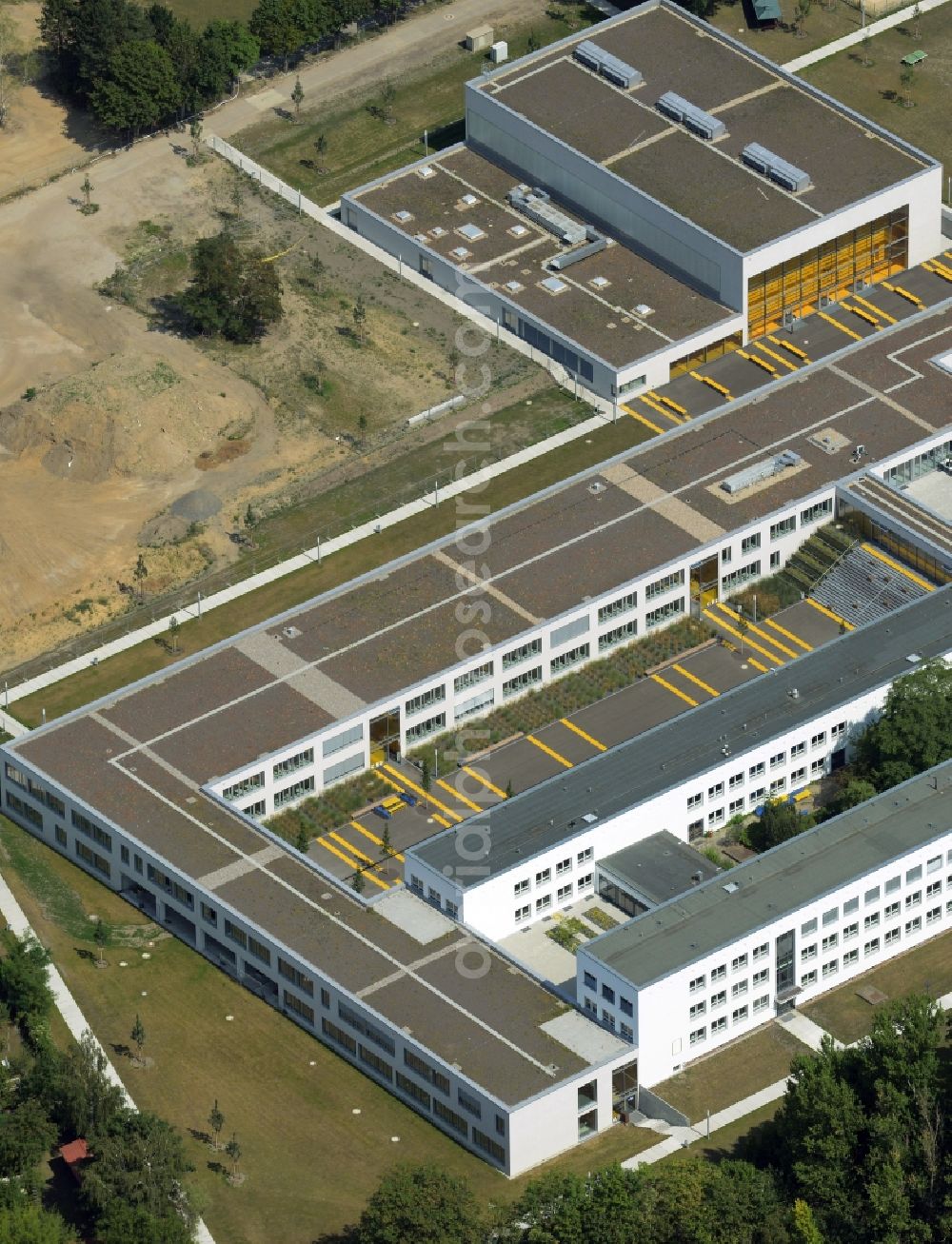 Aerial image Berlin - School grounds and buildings of the sports education centre SLZB in the Hohenschoenhausen part of the district of Lichtenberg in Berlin in Germany. The compound is distinct because of the yellow colour